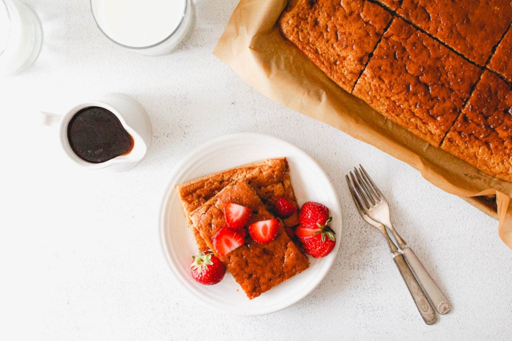 Sheet pan pancake served with maple syrup