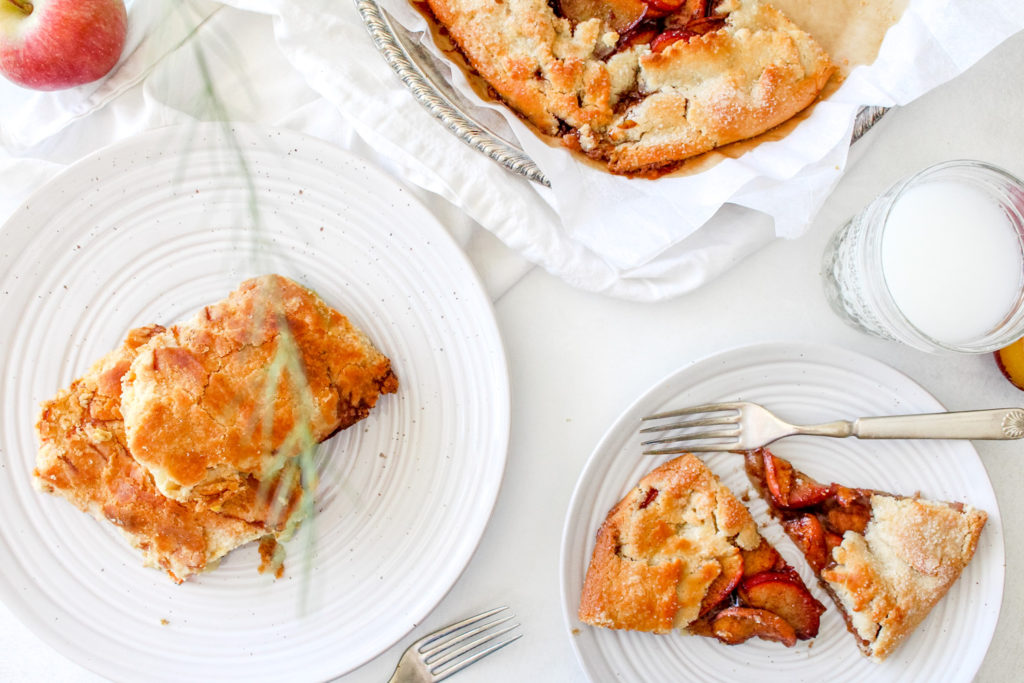 Ninnescah Homestead How to make a gluten free apple galette served on white linens and pottery with greenery.