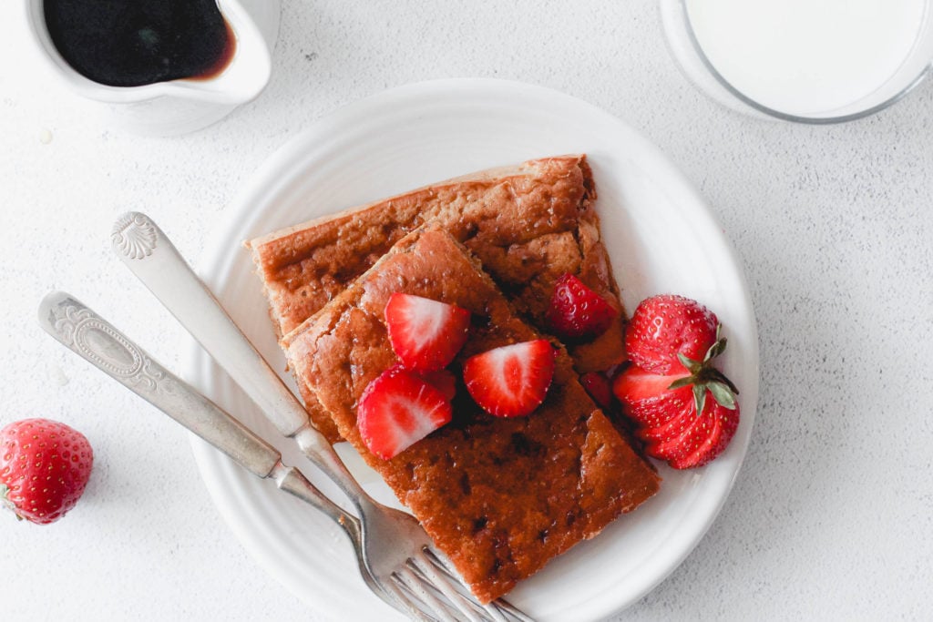 Sheet pan pancake served with maple syrup