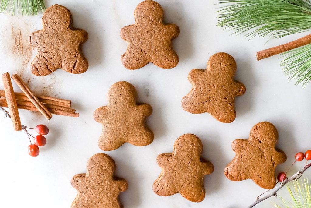 Gingerbread men waiting to be decorated with royal icing.