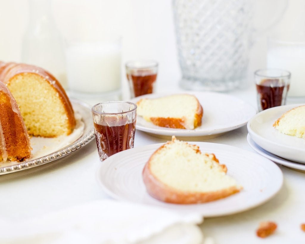 sliced buttermilk bundt cake with bourbon shots