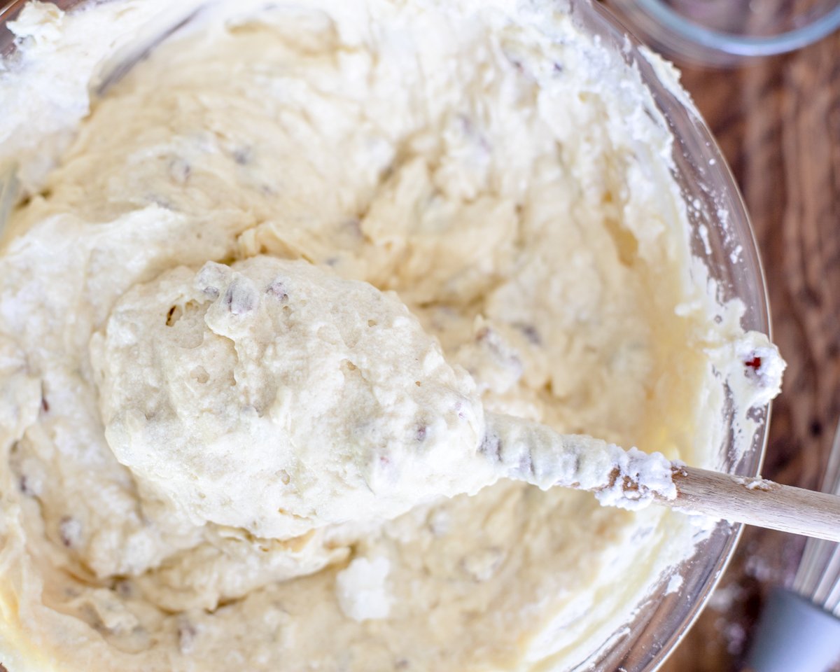 combining butter mixture with buttermilk and flour and egg whites in Italian cream cake.