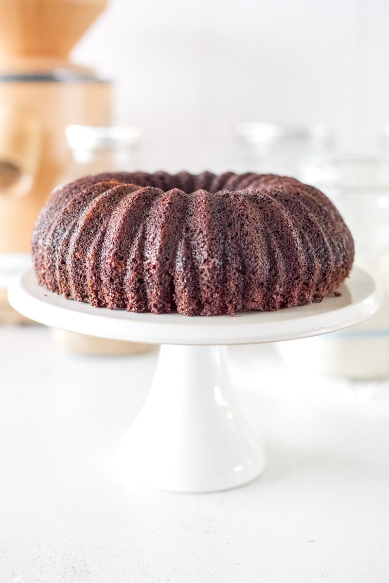 The sourdough bundt cake is finished when the edges pull away from the pan. Remove it from the oven when it passes the tooth pick test and let it rest for ten minutes before inverting the cake to remove it from the pan.