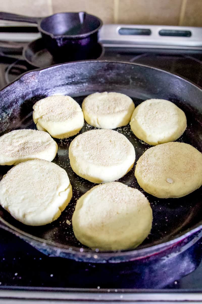 Cooking the English muffins in a preheated cast iron skillet.