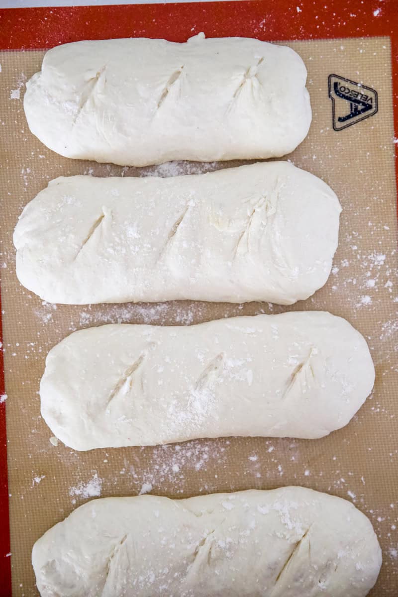 Step 5 of making sourdough baguettes is shaping the loaves.