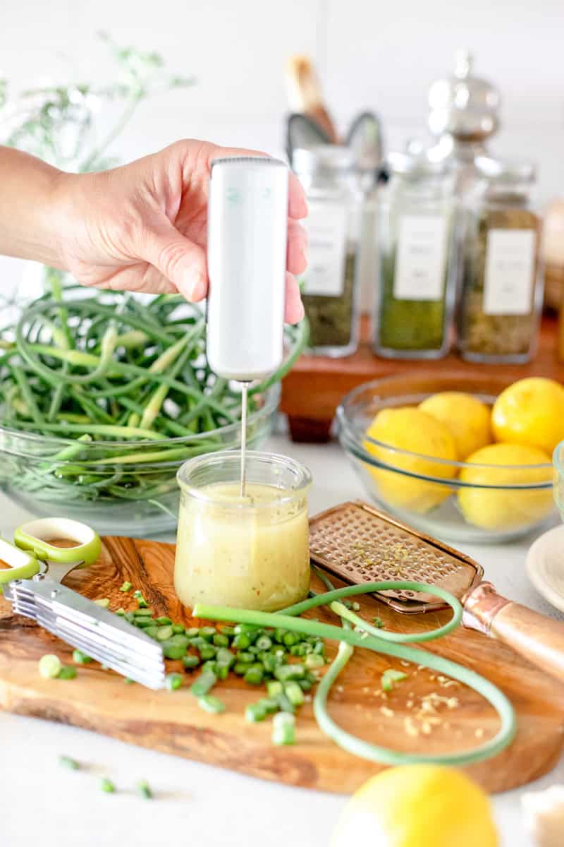 Step one of making a lemon vinaigrette is whisking the ingredients together.