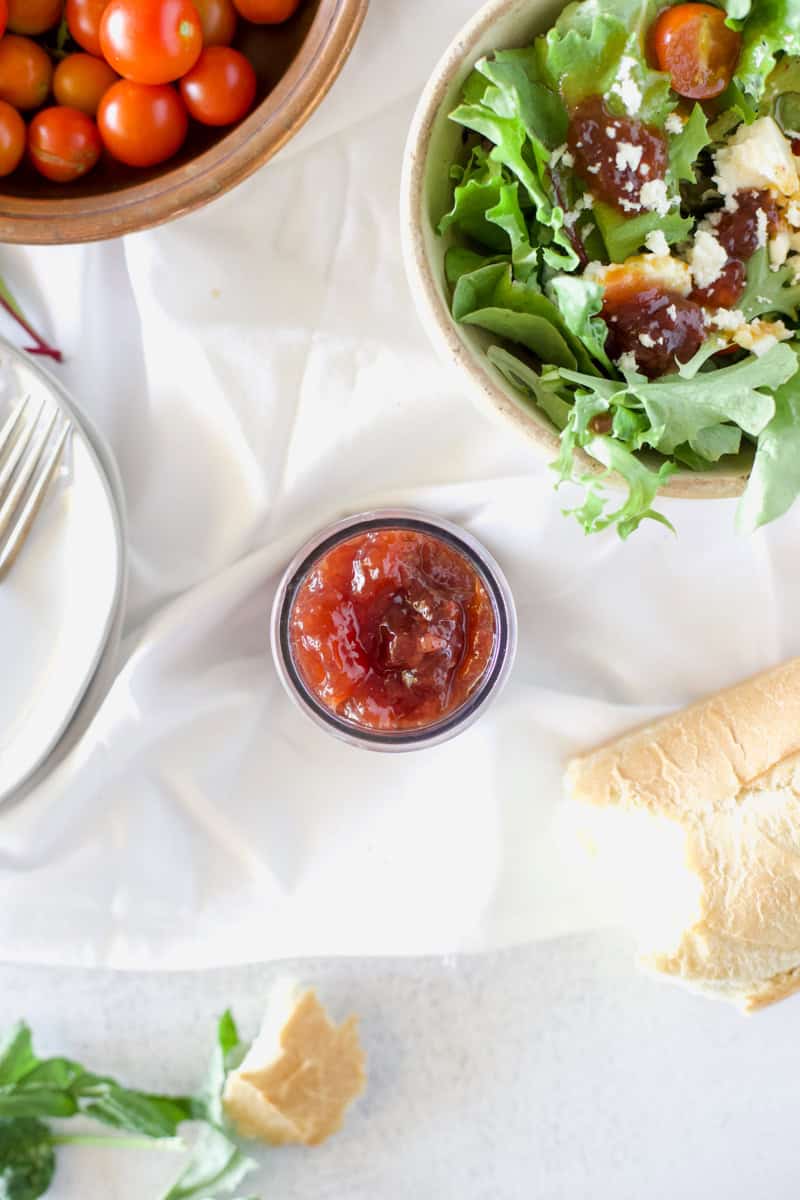 Step one of making a strawberry preserves smash salad with chicken is mixing the salad dressing.
