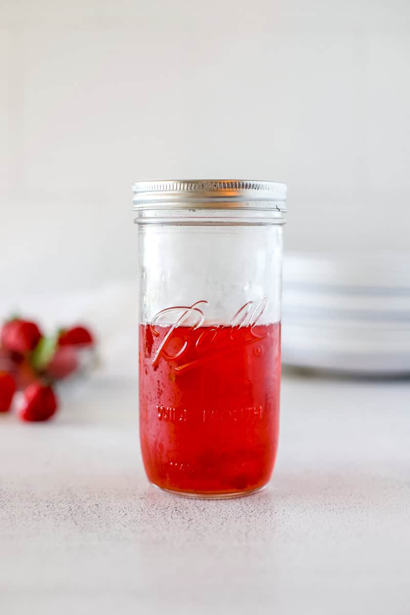 Step four of strawberry infused vinegar is storing it in a mason jar in the refrigerator for up to one month.