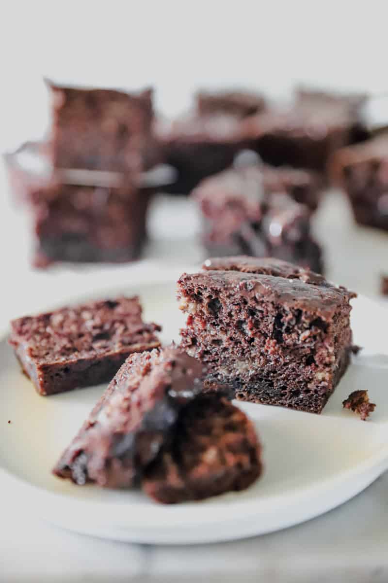 A close up view of sourdough banana bread bars with chocolate and chocolate chips.