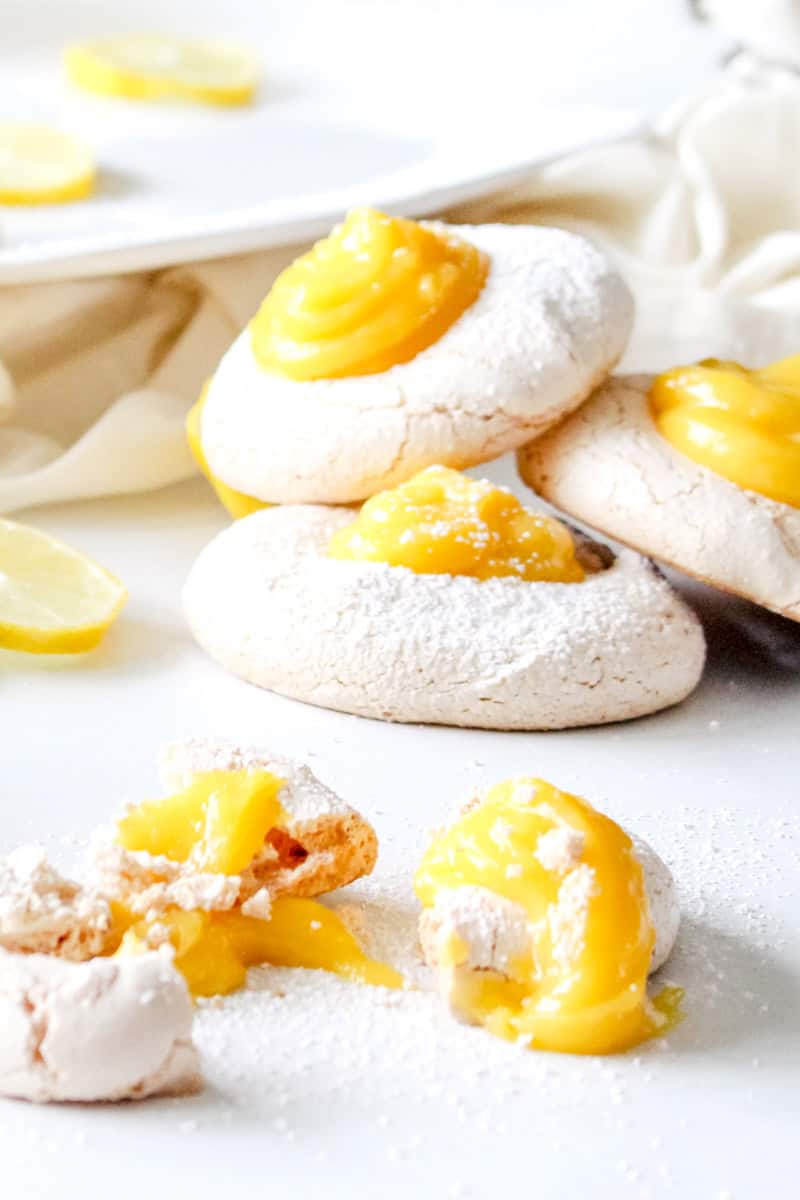 Lemon curd cookies with a thumb print and lemon meringue.