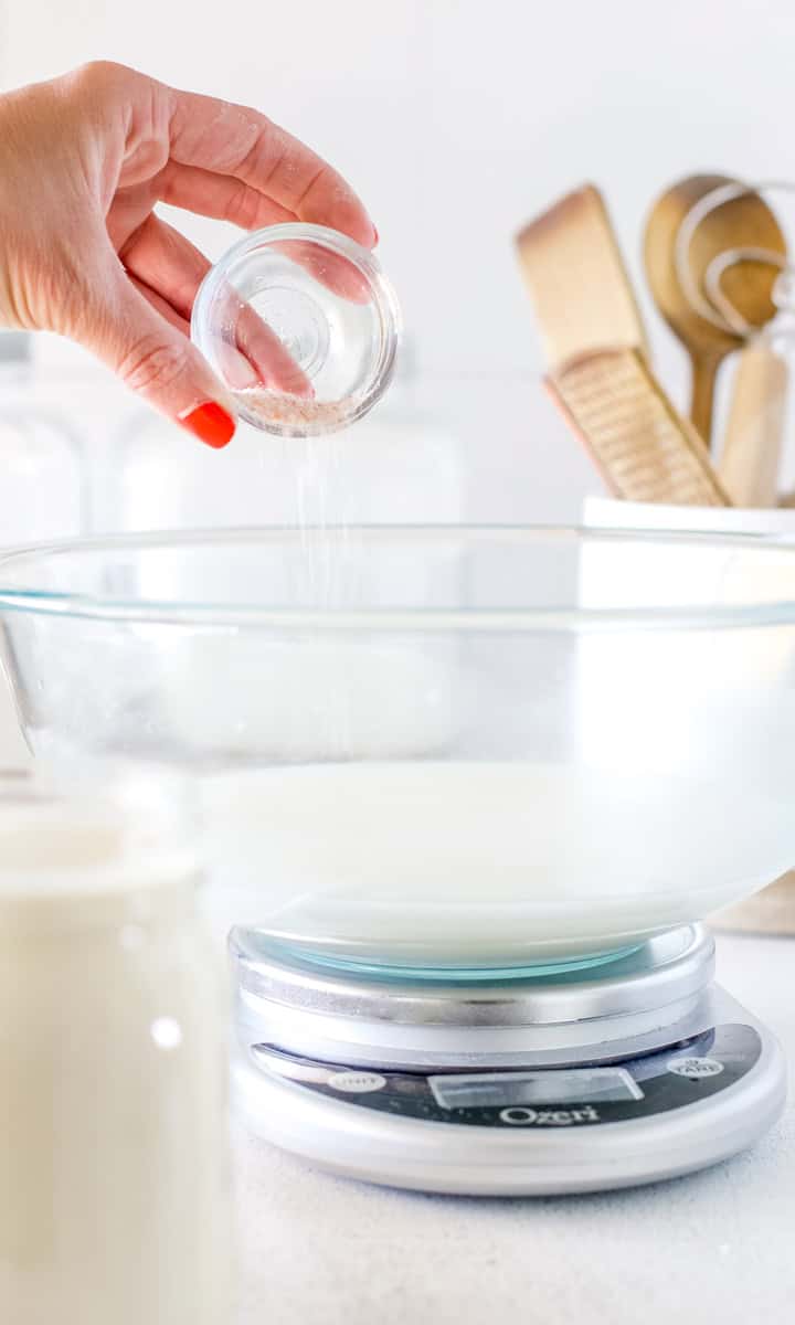 Steps of making cucumber pickle is making the brine by mixing vinegar, salt and water in a nonreactive bowl.