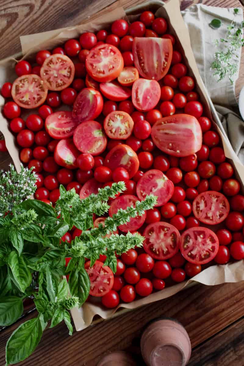 Step 1 of making creamy tomato soup is to Preheat the oven to 450°F Line a baking sheet with foil or parchment paper and spray with cooking spray or olive oil Wash and cut the tomatoes in half for small sized tomatoes, cut larger tomatoes into quarters or even eighths.
