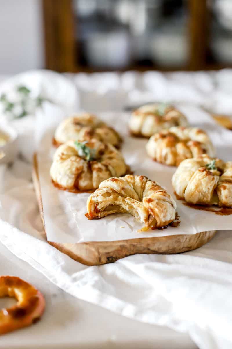 A bite shot of an apple thanksgiving puff pastry appetizers.