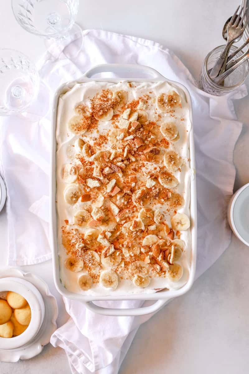 A top view of banana pudding with vanilla wafers in a 9X13 pan.