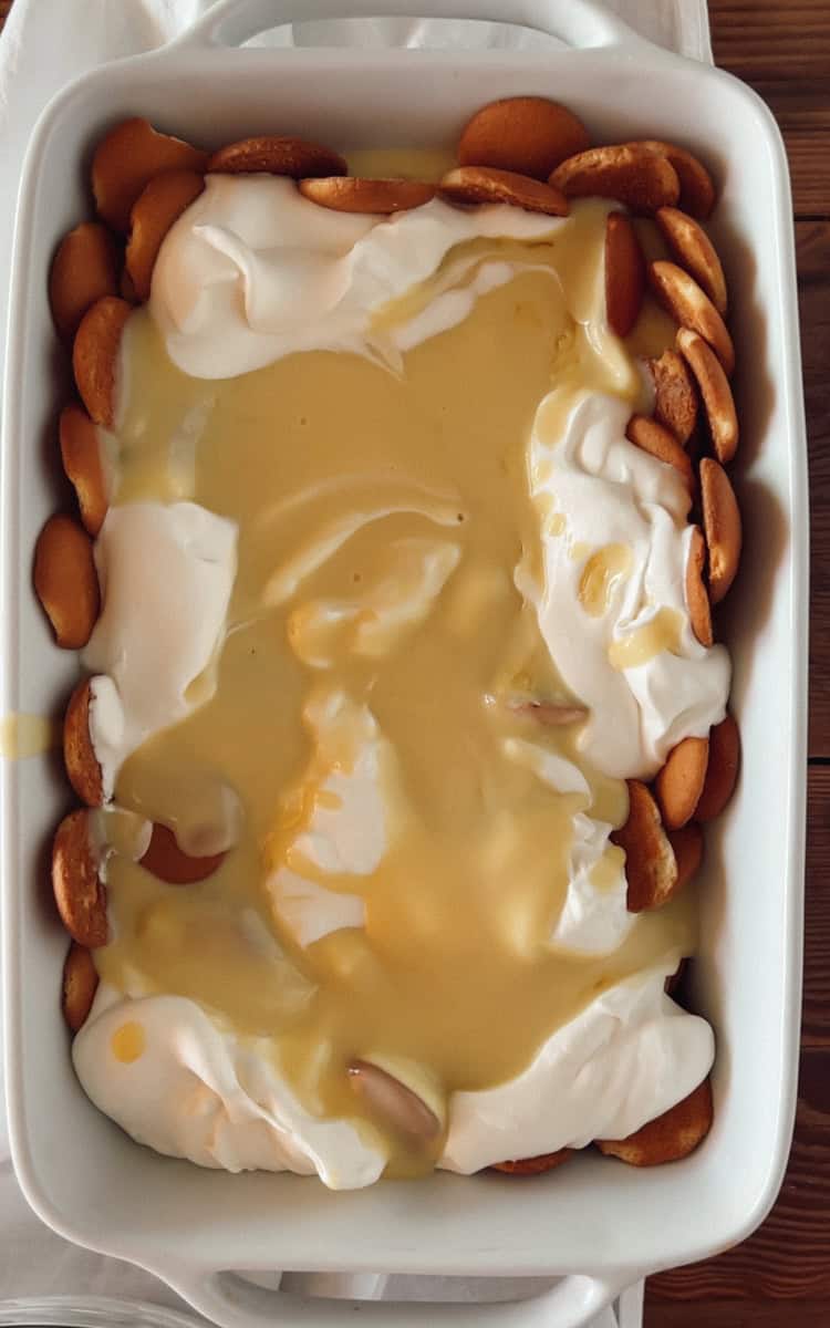 Step 3 of vanilla wafer pudding is adding a layer of pudding.