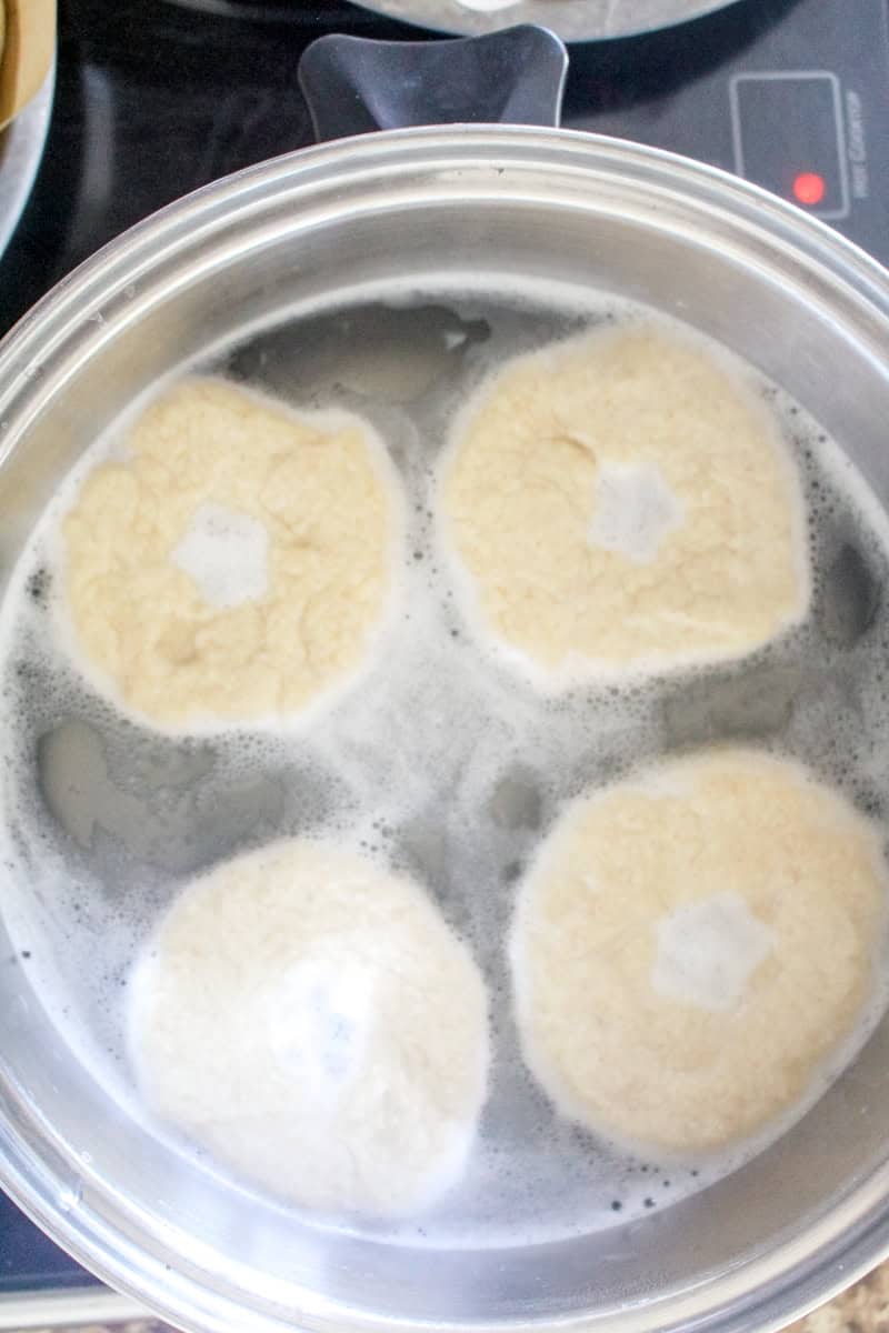 Step 5 of making sourdough bagels is boiling the bagels.