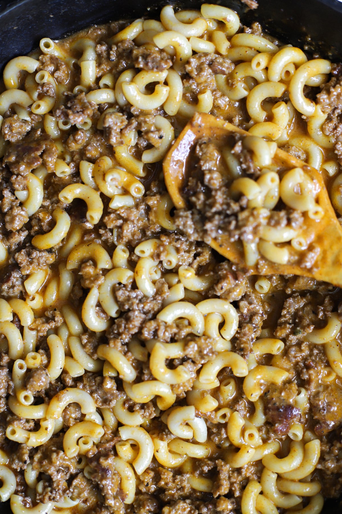 Making ground venison hamburger helper - add in the broth and bring the mixture to a simmer or low boil then stir in the uncooked macaroni.
