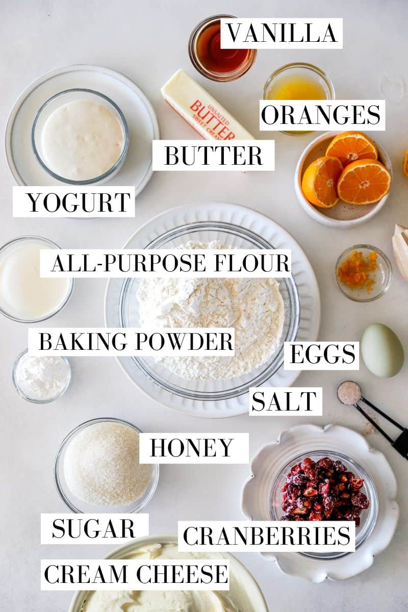 Ingredients for cranberry cream cheese bread in prep bowls and labeled.