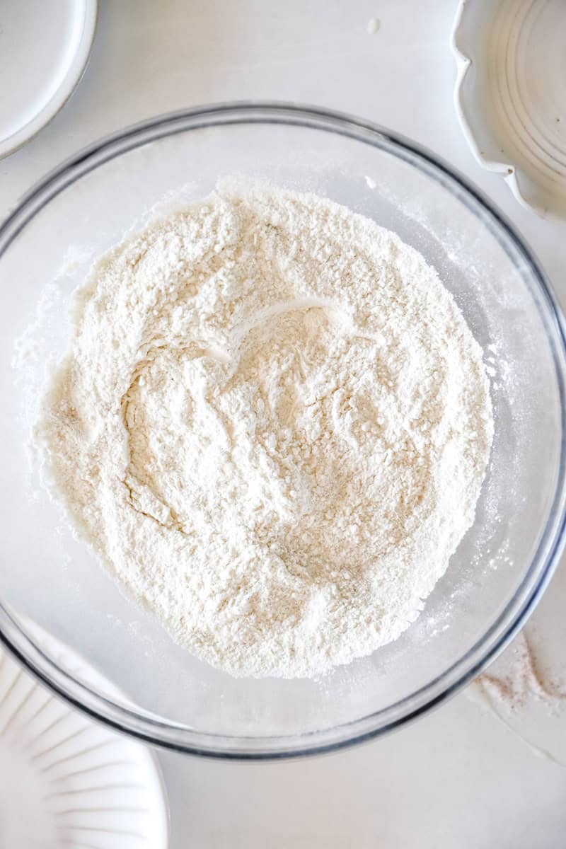 Step 2 of making scones is In a large mixing bowl, sift together the flour, sugar, baking powder, and salt.