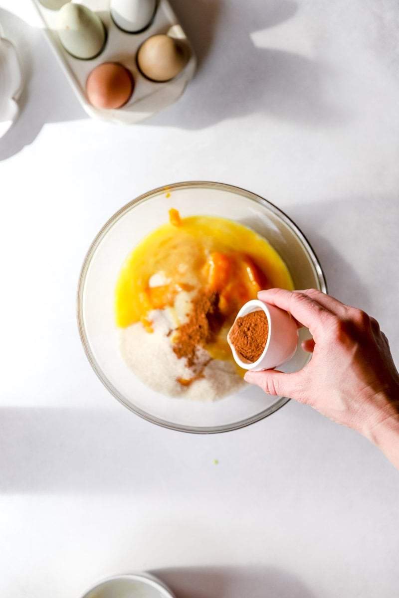 A bowl of pumpkin pie filling ingredients.
