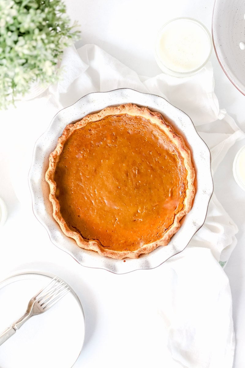A baked pumpkin pie fresh out of the oven.