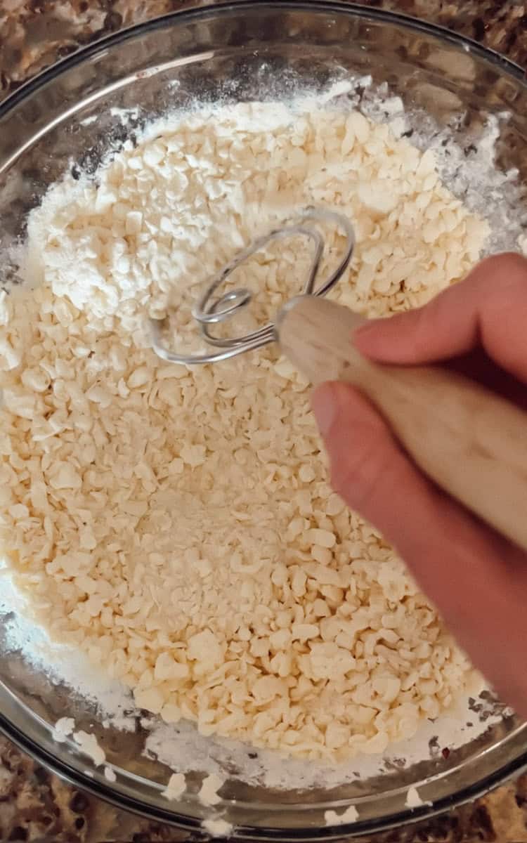Step 2 of making sourdough pie crust is cutting in the butter.