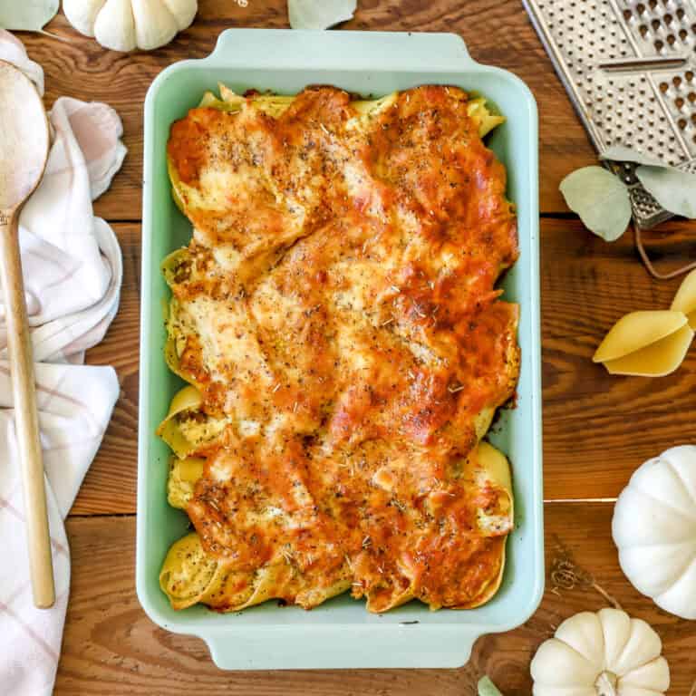 Stuffed shells with pumpkin marinara in a jadeite 9X13 pan.