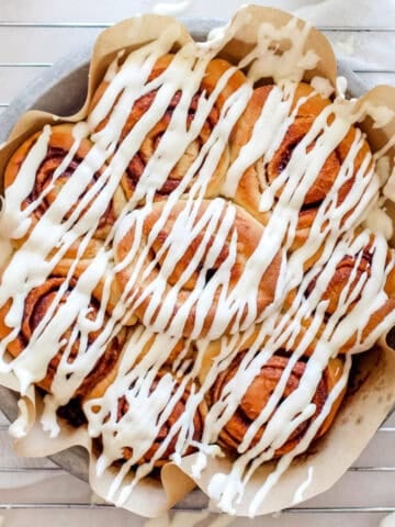 Cinnamon rolls drizzled with icing.