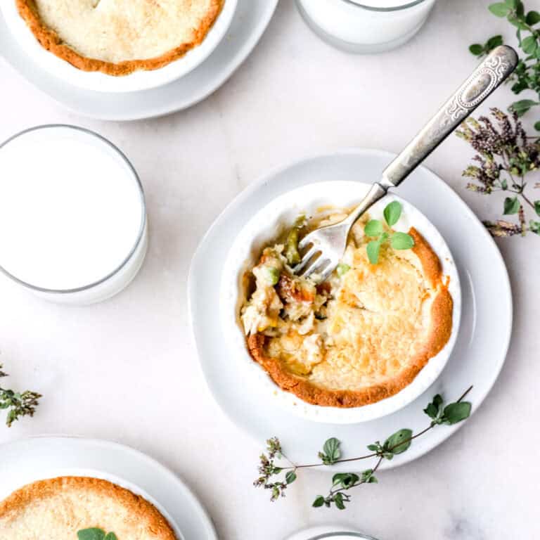 A trio of gluten-free chicken pot pies in little ramekin dishes.