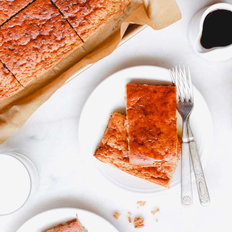 Sheet pan pancakes sliced on a plate.