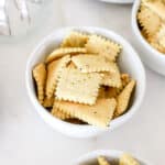 Sourdough crackers in a white bowl.