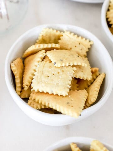 Sourdough crackers in a white bowl.