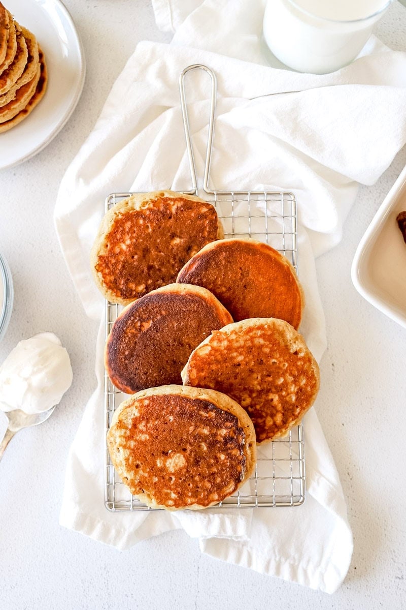 Buttermilk Sourdough Discard Pancakes on a wire cooling rack.