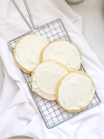 Sweet cream sugar cookies on a wire cooling rack.