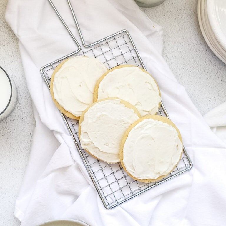 Sweet cream sugar cookies on a wire cooling rack.