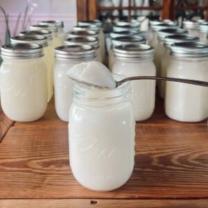 A spoonful of lard in a mason jar showing the detail up close.