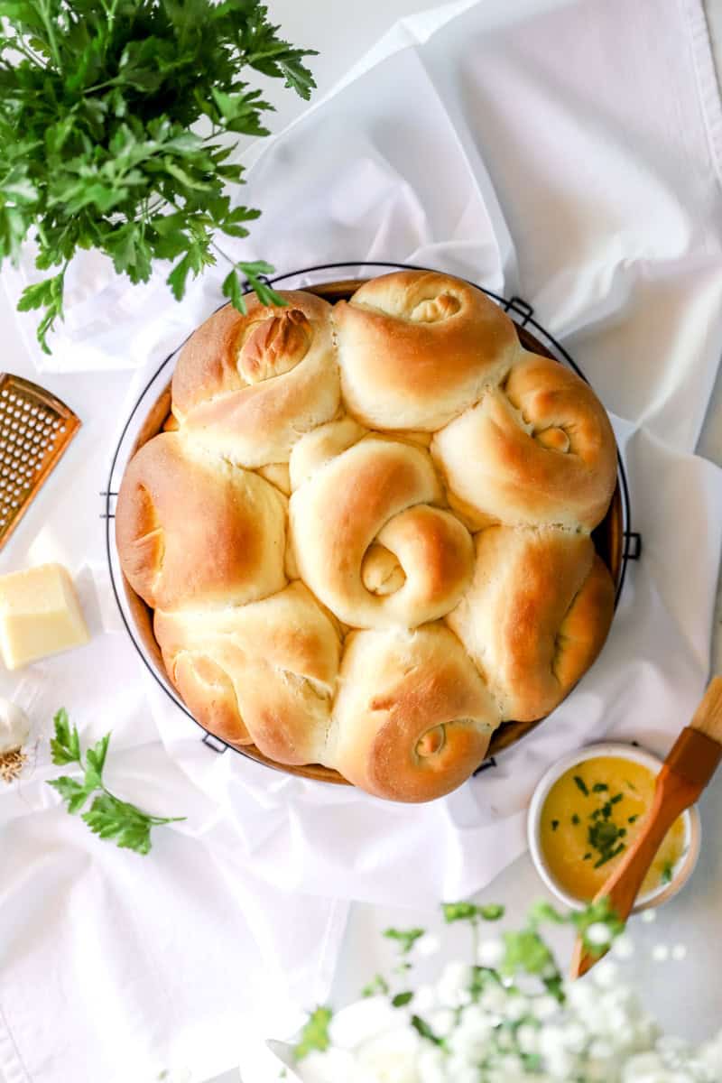 Step 7 is baking the garlic knots until golden brown.