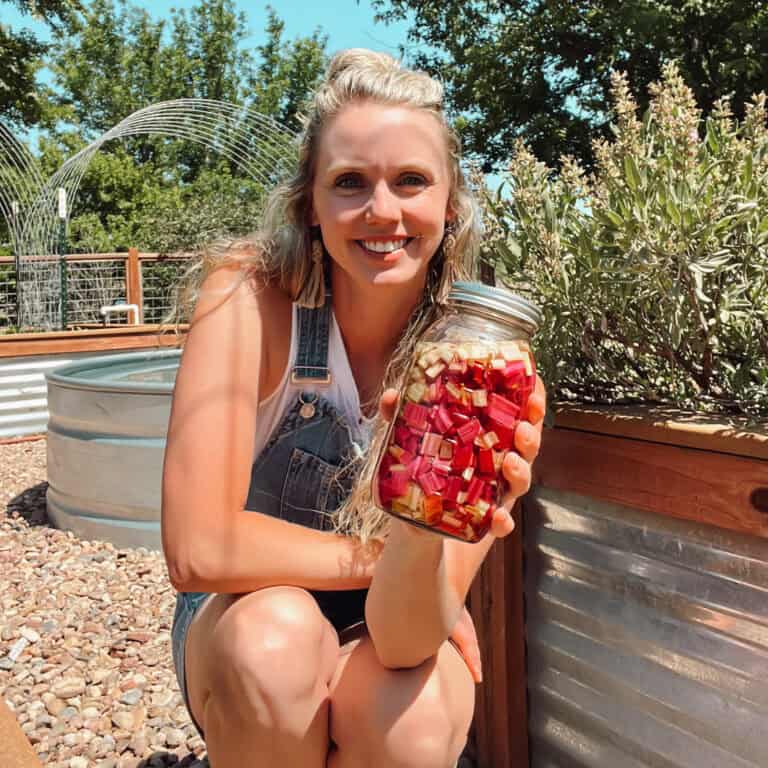 How to Swiss chard by refrigerating, freezing, freeze drying, fermenting and dehydrating with Meg holding a jar of chard.
