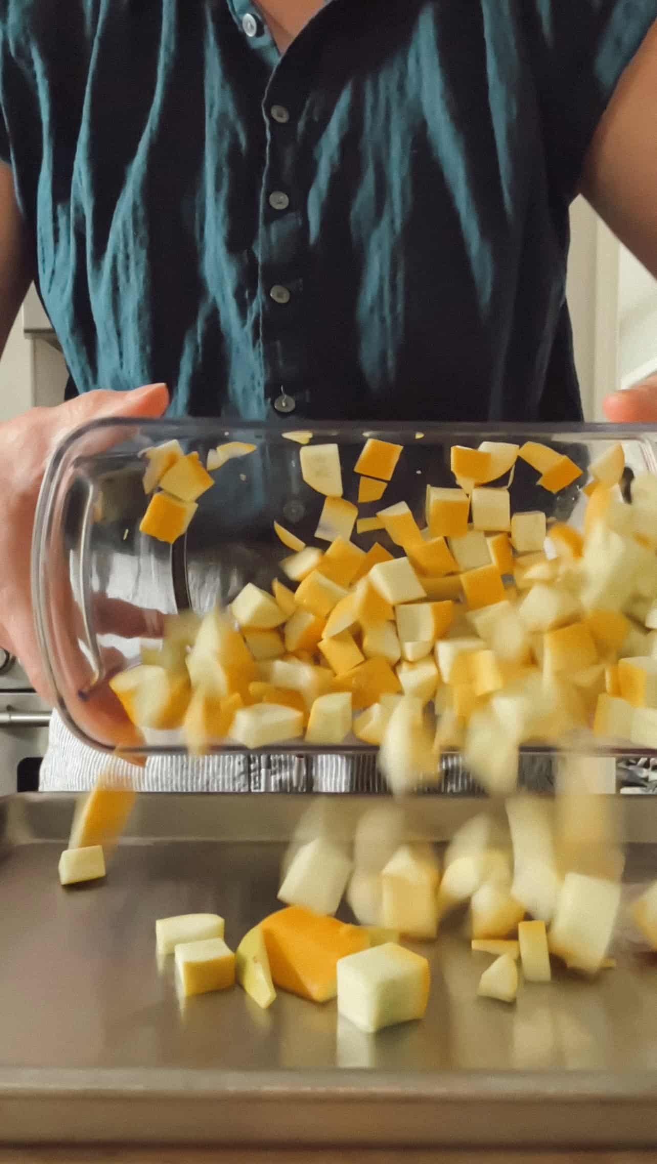 Step 3 of roasting squash is toss the sliced veggies in a large bowl, drizzle with olive oil until they're lightly coated.