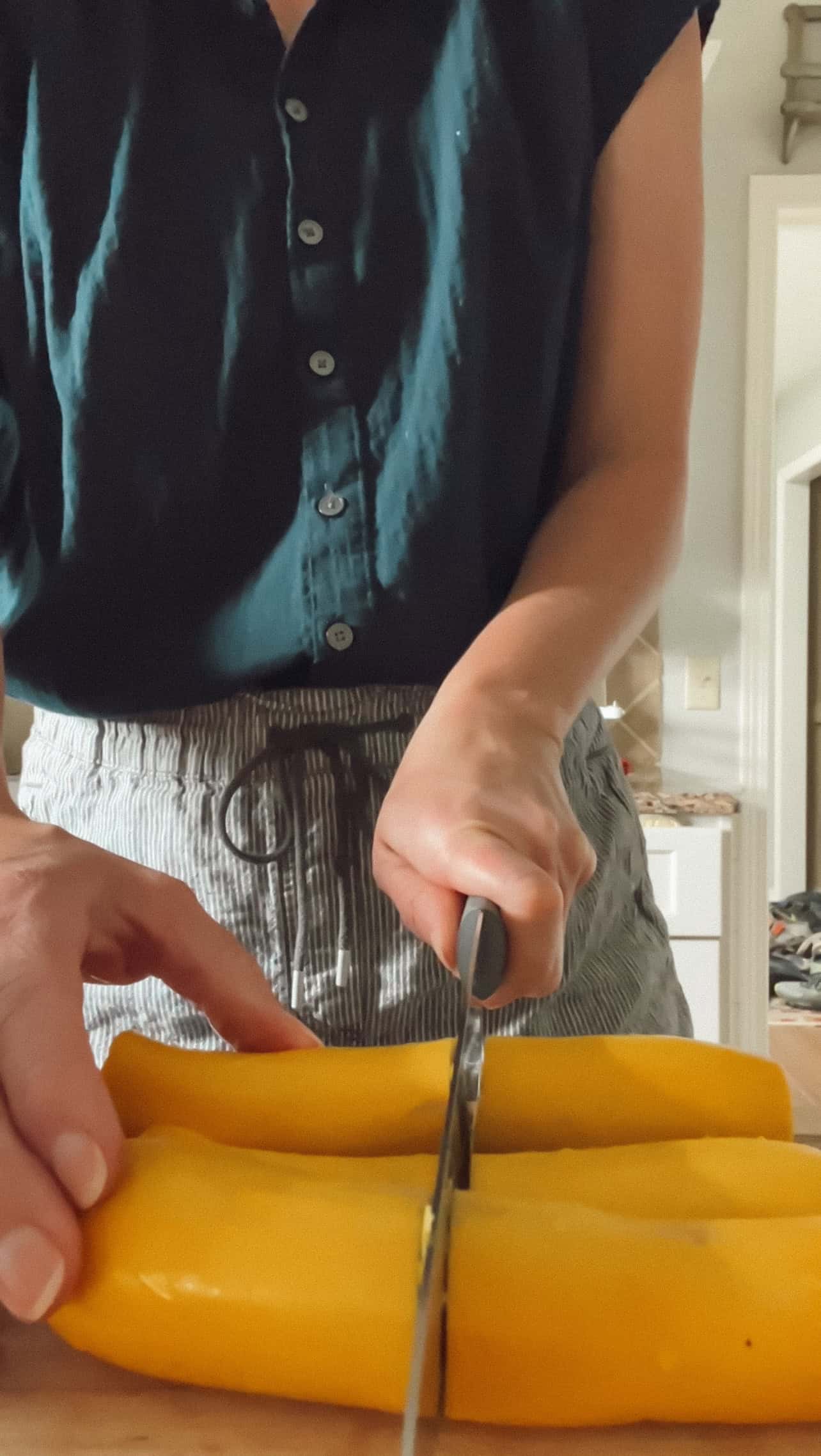 Step 2 of roasting squash is washed squash being sliced into rounds or half-moons—about ¼ inch thick. 