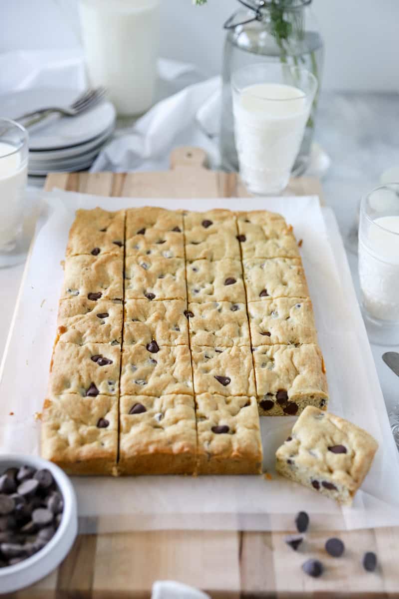 Sliced blondies on a wood cutting board.