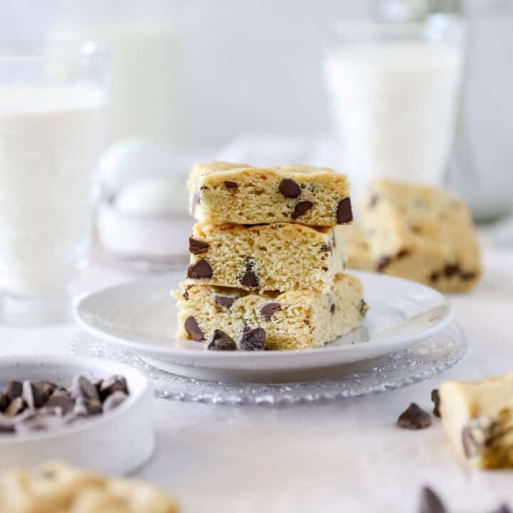 Side view of sourdough blondies stacked 3 high on a plate.