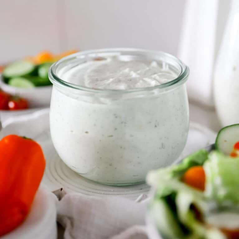 A close up view of cottage cheese ranch dip in a weck jar.