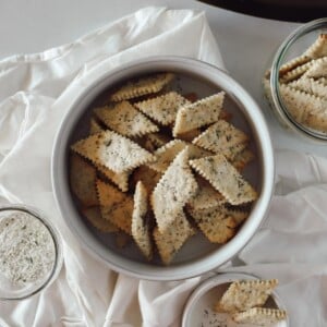 Top view of sourdough ranch crackers in a white bowl.