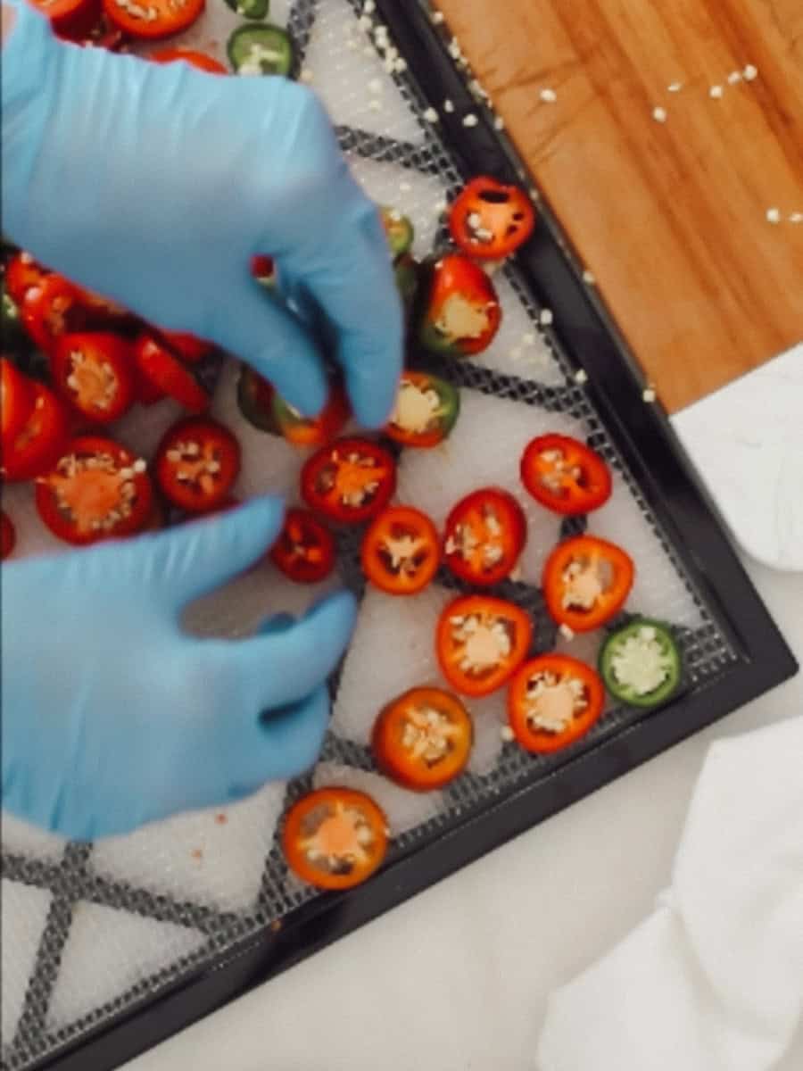 Arrange the peppers on a dehydrator tray, not touching.
