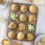 A top view of zucchini banana muffins in a muffin pan.