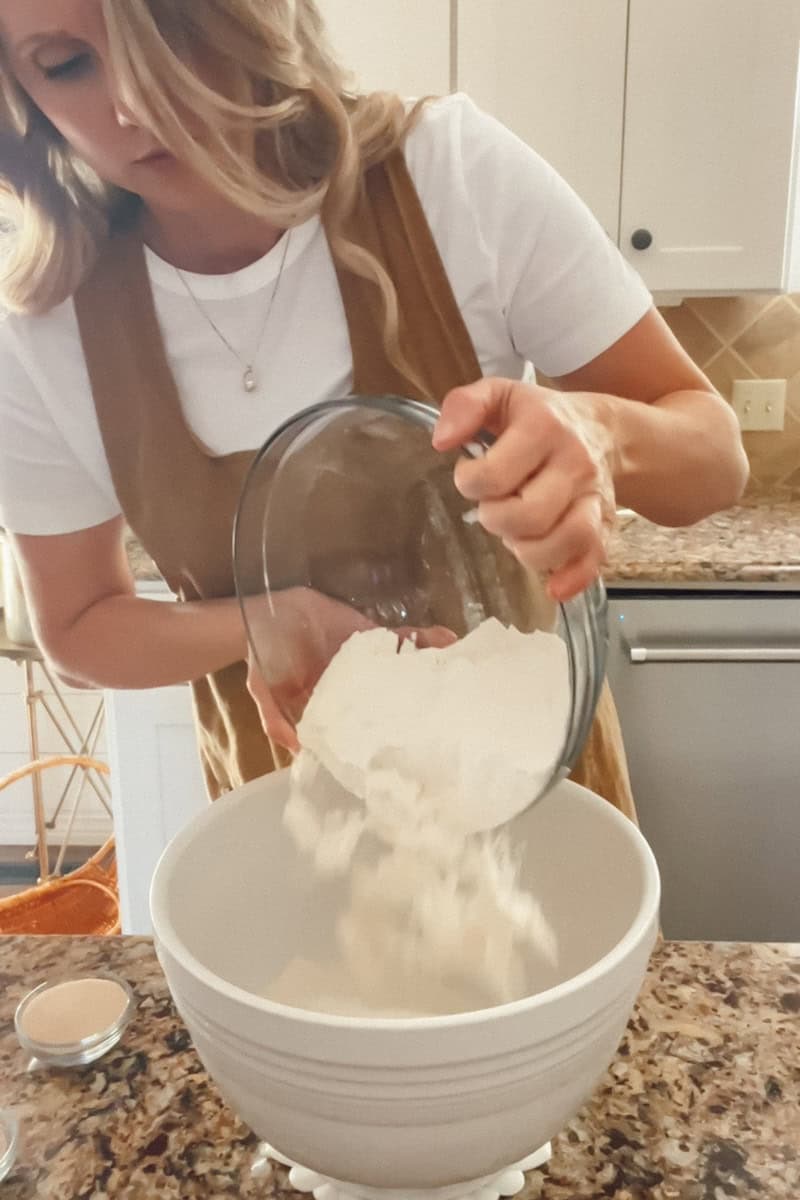 Step 3 Continuing on a slow speed, add the remaining one cup of flour, a few tablespoons at a time until the dough clings to the hook and the sides of the bowl are clean.