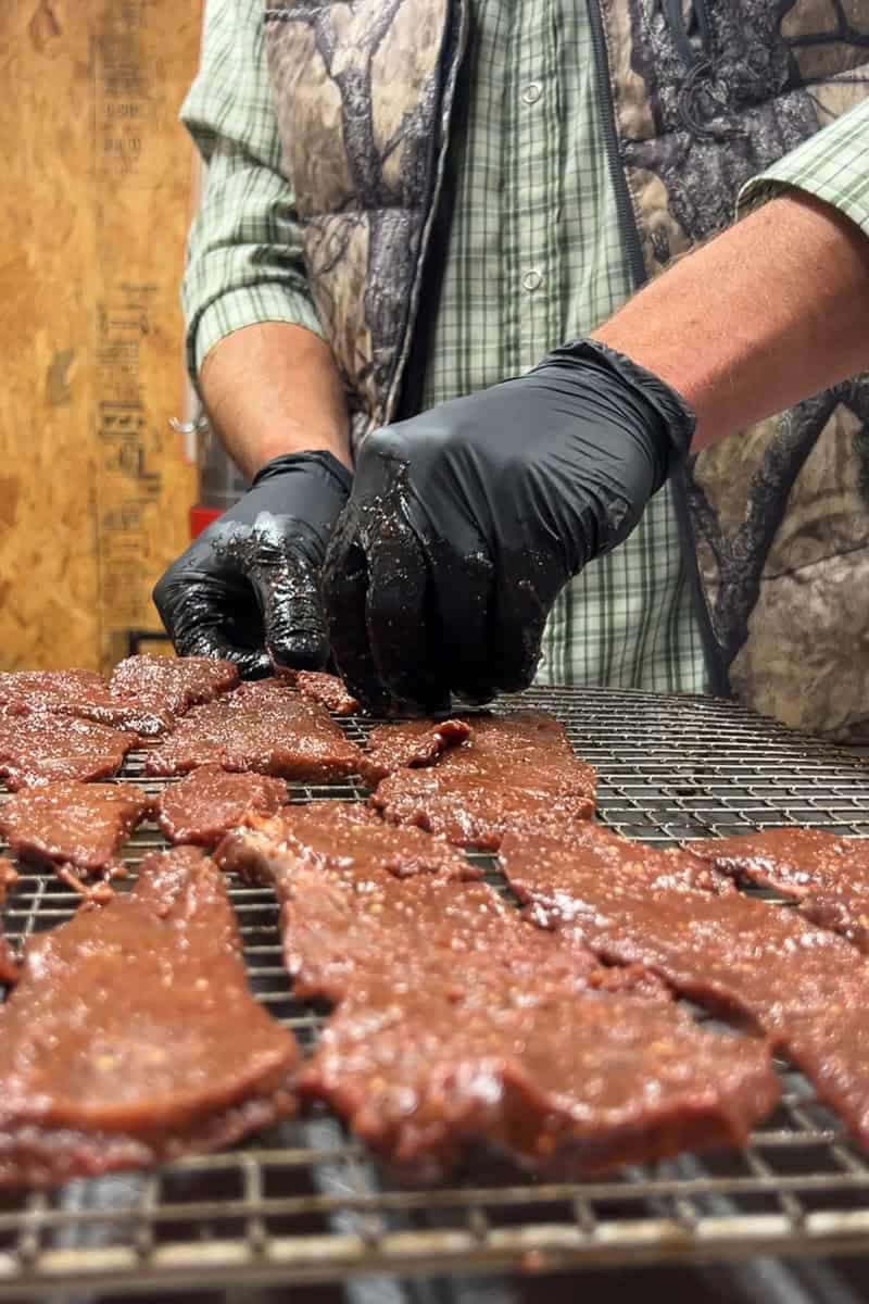 Step 3 is putting the jerky on the trays for smoking or dehydrating.