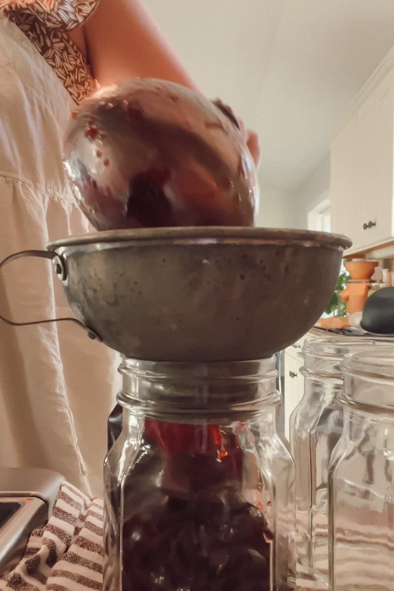 Step 3 is ladling the hot sauce into prepared jars.