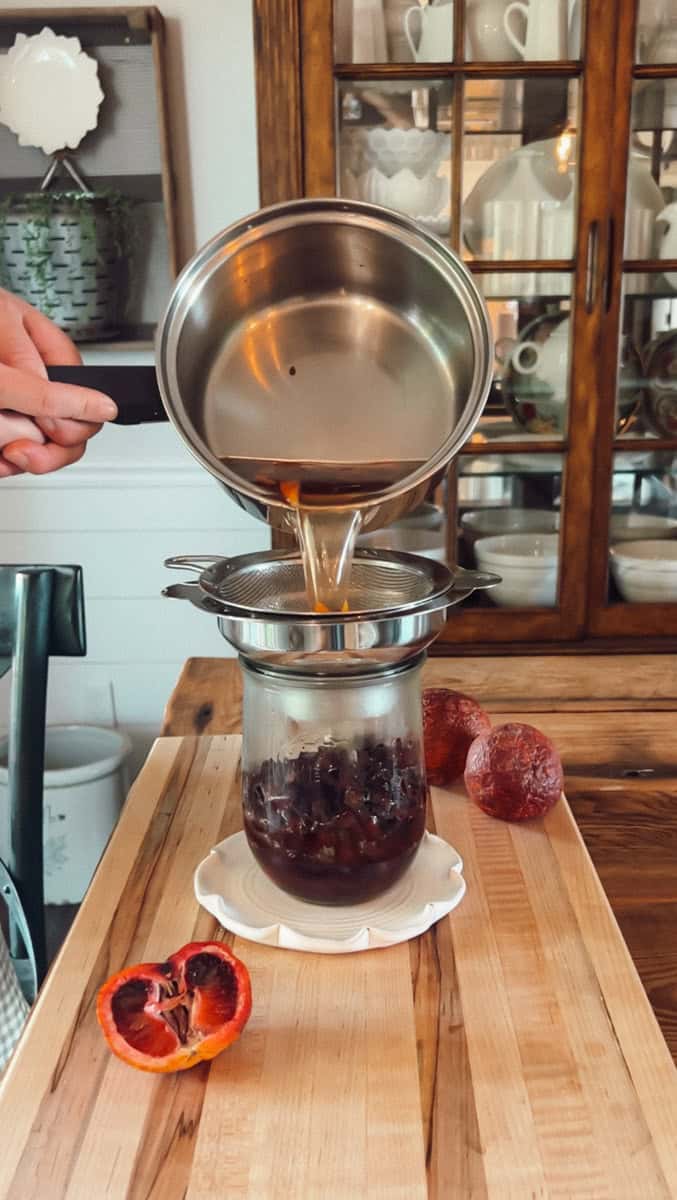 Step 2 of assembling the pickled beets is pouring the hot brine over the beets.